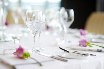 Beautiful table setting with crockery and flowers for a party, wedding reception or other festive event