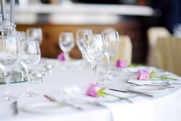 Beautiful table setting with crockery and flowers for a party, wedding reception or other festive event