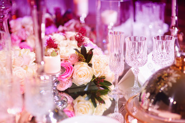 Beautiful table setting with crockery and flowers for a party, wedding reception or other festive event
