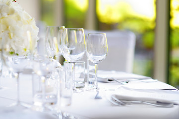 Beautiful table setting with crockery and flowers for a party, wedding reception or other festive event