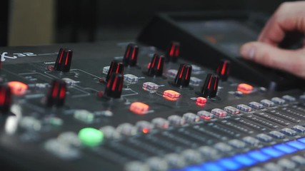 4K : Close up of sound designer working on the sound control