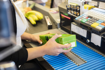 Cropped Image Of Cashier Scanning Juice Pack's Barcode