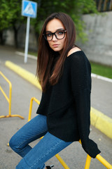 Woman hipster glasses summer in the city. The concept of lifestyle and fashion