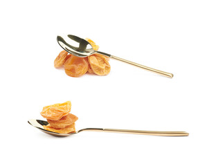 Spoon of dried apricots isolated