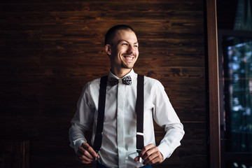 The fiance stands near window