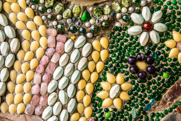 Phetchabun, Thailand - February 23.2017: Buddha statues and colored foot path colorful glass stacked in Wat Pha Kaew, Khao Kho, Phetchabun at Thailand.