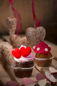 cupcakes with white cream and red hearts