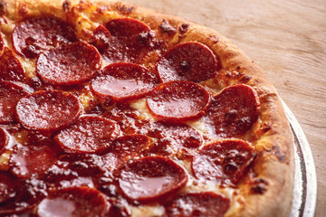 Fresh baked pepperoni pizza, shallow depth of field