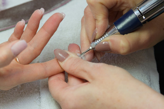 processing nails in nail salon