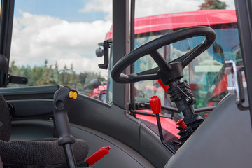 Steering wheel and levers in the cab closeup. Industry