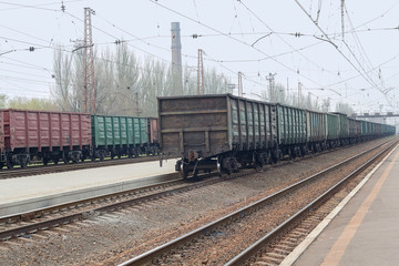 Fototapeta na wymiar Freight wagons are standing in line at the railway station. Industry