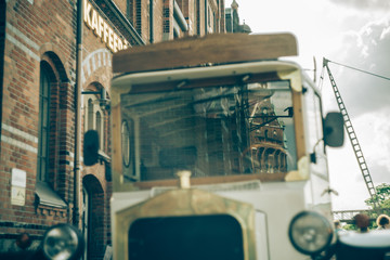 Oldtimer vintage transport vehicle standing in front of the 