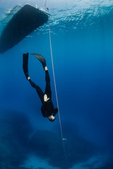 Freediver descending down a line