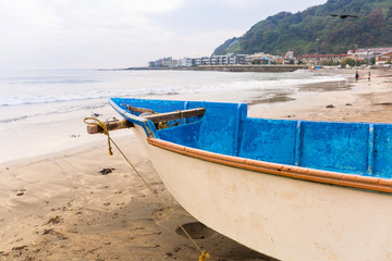 Fishing boat on the coast of Pacific ocean in Kamakura, Japan