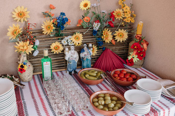 wedding buffet table with pickled cucumbers and tomatoes