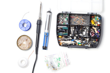 Electronics parts and components and tools for soldering, solder iron on a white background