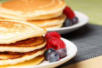 Pile of Pancakes with blueberries and raspberries