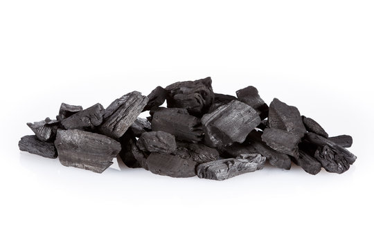 Pile of charcoal isolated on white