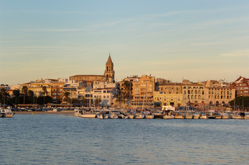 Fototapeta premium Sunset at the fishing port and village of Palamos, Girona province, Catalonia, Spain