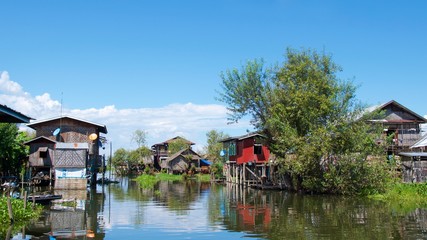Fototapeta na wymiar Houses on the water in Inle Lake, Myanmar