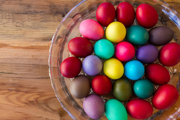 Colorful Easter eggs on wood