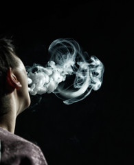 Vape trick jellyfish in performance of vaper on dark background