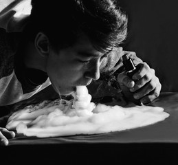 Vape trick waterfall in performance of vaper on dark background