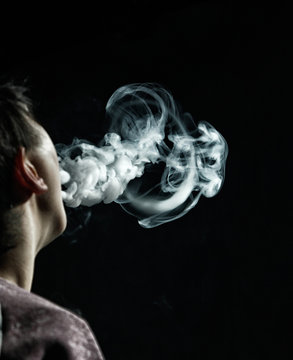 Vape trick jellyfish in performance of vaper on dark background Stock Photo | Adobe Stock Vape trick jellyfish in performance of vaper on dark background Stock Photo | Adobe Stock