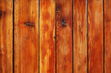 Worn out varnished wooden fence texture
