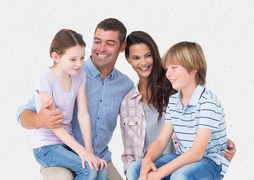 Parent and children smiling against a white background