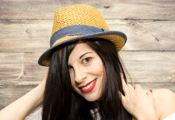 Beauty Woman with hat  on a wooden background