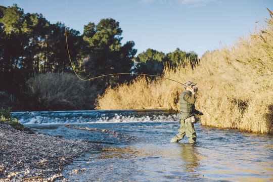 Man in river throwing a tackle