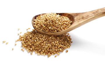 pile wheat kernels with wooden spoon isolated on white background