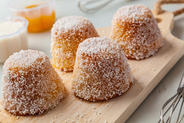 Small cakes with white aniseed sprinkles.