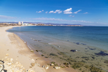 Beach and clear blue sea with swans