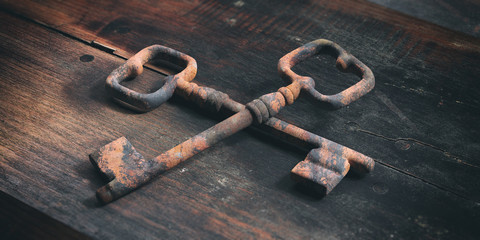 Old keys on a wooden background. 3d illustration