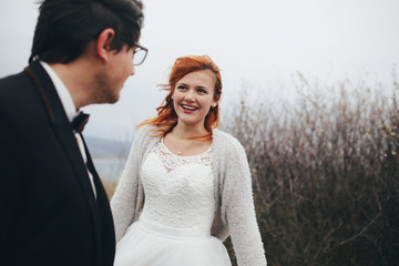 The bride looking at her groom