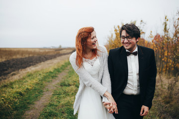 The brides walking along bank