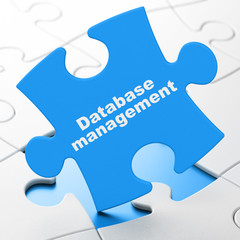 Programming concept: Database Management on puzzle background