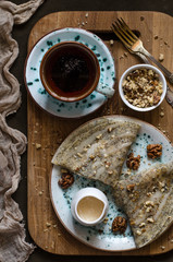 Pancakes on the apple juice with poppy seeds nuts and honey