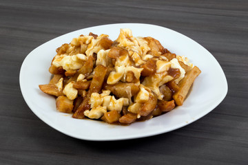 Poutine quebec meal with french fries, gravy and cheese curds