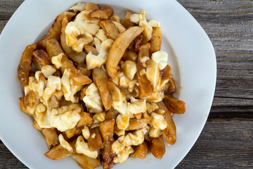Poutine quebec meal with french fries, gravy and cheese curds