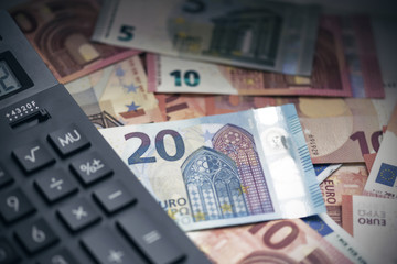 Calculator and money on the table at a office