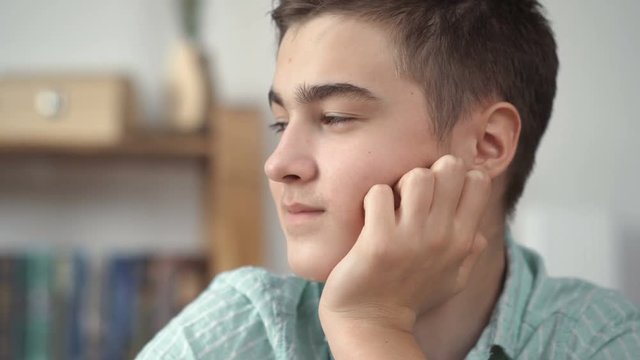 Boy thinks on a white background