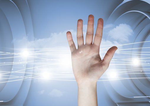 Composite image of open Hand against a Futuristic Electric sky 
