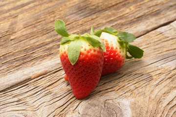 fresh strawberries on the brown wooden table