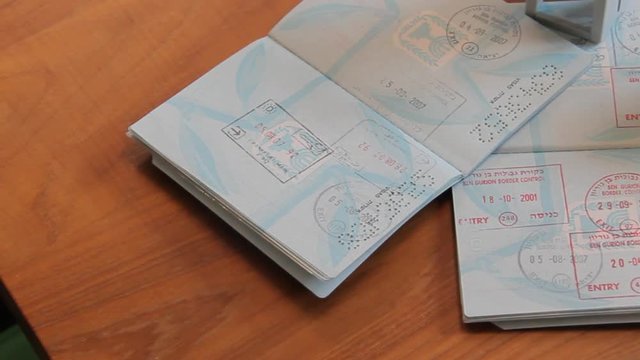 Passports on Brown Wooden Desk