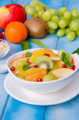 Fresh fruit salad in a bowl. Healthy dish.