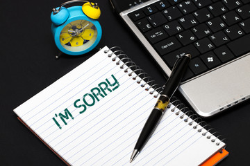 I'm sorry text concept write on notebook