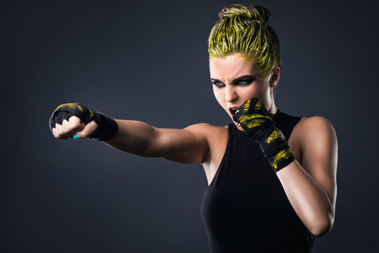 Woman mma fighter with yellow hair